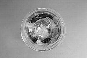 Ice in a glass with vermouth top view