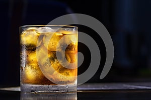 Ice in glass, water drops on glass, cold drink, put on the table,Soft focus,selected focus,shallow depth of field