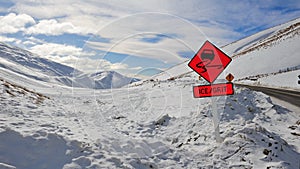 Ice and grit warning sign