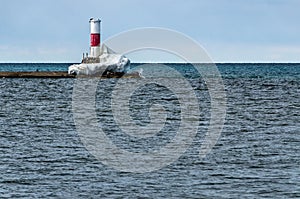 Ice Hanging On to a Beacon in Lake Michigan