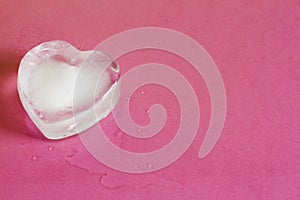 Ice heart on pink abstract valentine love background