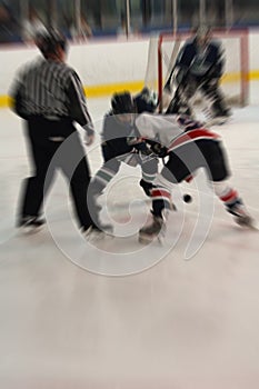 Ice hockey face off action blur