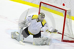 Ice hockey goalie makes a glove save