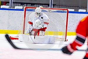 Ice hockey goalie makes a great save