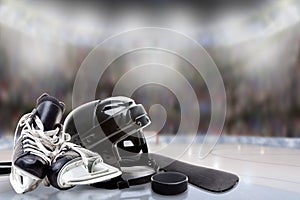 Ice Hockey Helmet, Skates, Stick and Puck in Rink