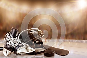 Ice Hockey Helmet, Skates, Stick and Puck in Rink