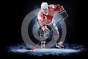 Ice hockey player isolated on black background