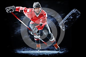 Ice hockey player isolated on black background