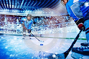 Ice hockey player passing the puck to teammate