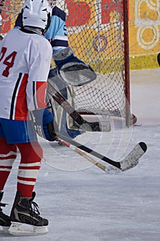 Ice hockey player shoots and scores