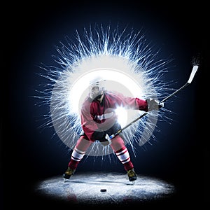 Ice Hockey player is skating on a abstract background photo