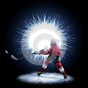 Ice Hockey player is skating on a abstract background photo