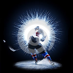 Ice Hockey player is skating on a abstract background photo