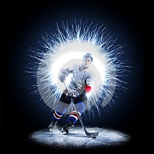 Ice Hockey player is skating on a abstract background photo