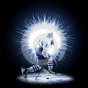 Ice Hockey player is skating on a abstract background photo