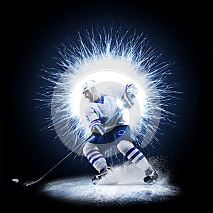 Ice Hockey player is skating on a abstract background photo