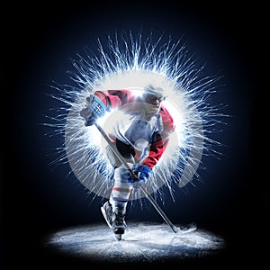 Ice Hockey player is skating on a abstract background photo