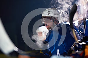 Ice hockey players on bench