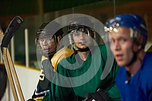 Ice hockey players on bench