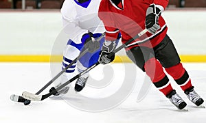 Ice hockey players in the competitive match in the rink