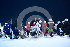 Ice hockey players team meeting with trainer