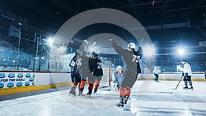 Ice Hockey Rink Arena: Forward Player Hit The Puck, Scored a Goal. Professional Hockey Team Celebra