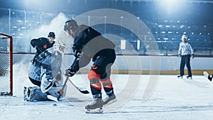 Ice Hockey Rink Arena: Goalie Against Forward Player who is Doing Slapshot, Shots Puck with Stick