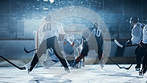 Ice Hockey Rink Arena: Professional Forward Player Masterfully Dribbles, Breaks Defense, Hitt