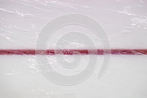 Ice hockey rink red markings closeup, winter sport background