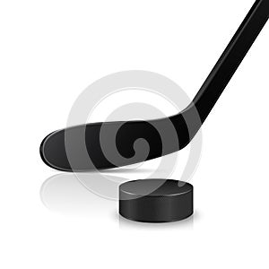 Ice hockey stick and puck