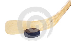 Ice hockey stick and puck isolated on white