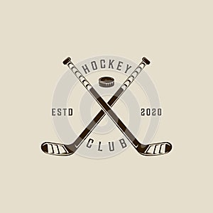 ice hockey stick and puck logo vintage vector illustration template icon graphic design. winter sport club sign or symbol for