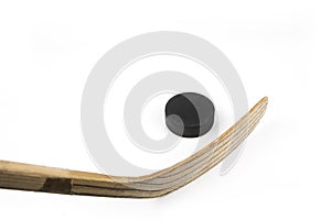 Ice hockey stick and puck on a white
