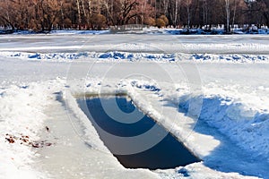 Ice-hole in frozen lake