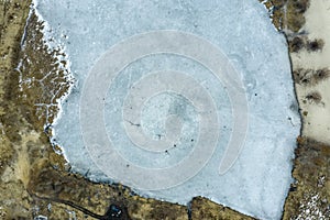 Ice hole, frozen lake, aerial view