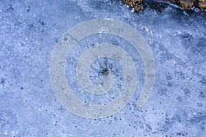 Ice hole, frozen lake, aerial view