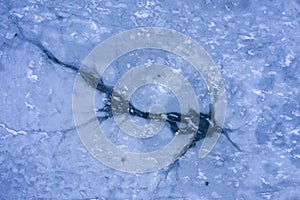 Ice hole, frozen lake, aerial view