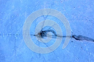 Ice hole, frozen lake, aerial view