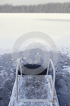 ice hole with handrails for swimming in the winter