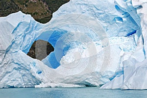 Ice hole in an iceberg, patagonia, argentina