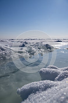 Ice hummocks on the ice in winter