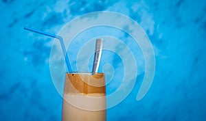 Ice instant coffee on blured blue background