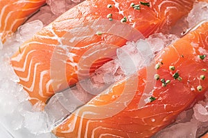 Ice kissed salmon fillets showcased in a tantalizing close up shot