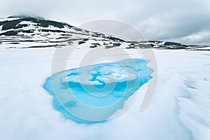 Ice lake near Aurlandsfjellet - tourist route in Norway