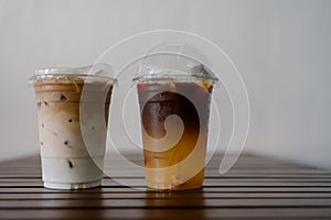 Ice latte coffee and espresso shot mixed with orange juice