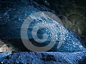 Ice layer over the lava rock of an ice cave