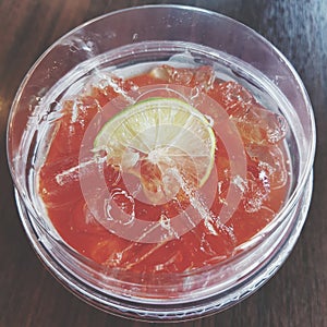 Ice lemon tea in plastic glass photo