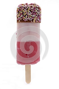 Ice lolly with sprinkles over white photo