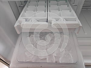 Ice maker container in the refrigerator photo