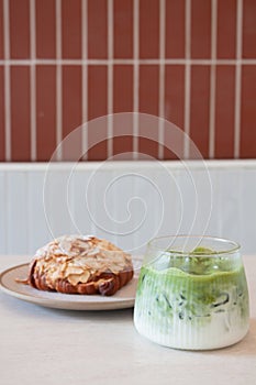 Ice matcha green tea served with croissant